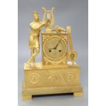 A French Empire design ormolu eight day mantel clock, the case surmounted with a Grecian figure