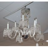 A modern cut glass tiered chandelier with circular prismatic drops, drop 29cm