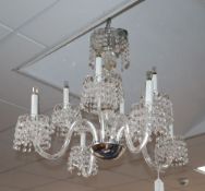 A modern cut glass tiered chandelier with circular prismatic drops, drop 29cm