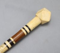A 19th century whalebone and marine ivory pointer stick, length 89cm (a.f.)