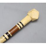 A 19th century whalebone and marine ivory pointer stick, length 89cm (a.f.)