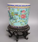 A Chinese turquoise glazed 'dragon' jardiniere and wood stand, overall 33cm