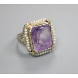 A seed pearl and amethyst dress ring, the shank stamped '14k', size L/M