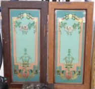 A pair of pine doors inset decorative reverse-painted and gilded glass panels with floral and