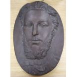 A bronze oval relief of a gentleman, signed A. Husson, dated 1872, length 37cm