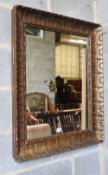 A giltwood and gesso rectangular acanthus framed wall mirror, 74 x 84cm