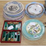 A set of six French earthenware plates, faience plates etc and pottery knife rests