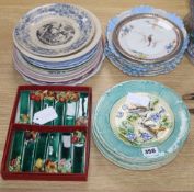 A set of six French earthenware plates, faience plates etc and pottery knife rests