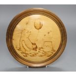 A poker work plaque of Winnie the Pooh, diameter 24.5cm