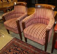 A set of four mahogany framed tub shaped theatre viewing armchairs, with red and cream striped