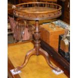 A George III style mahogany circular galleried tripod table, 48cm diameter, H.64cm