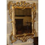 A cartouche-shaped giltwood wall mirror, W.70cm, H.86cm