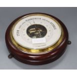 A circular wall barometer, diameter 27cm