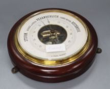 A circular wall barometer, diameter 27cm