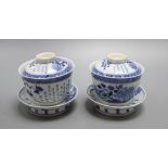 A pair of Chinese blue and white tea bowls with covers and stands, overall height 10cm