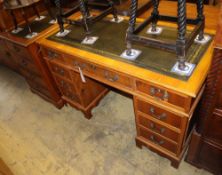 A reproduction yew pedestal desk, W.120cm, D.59cm, H.76cm together with a similar two drawer