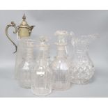 Four glass decanters, a claret jug and another jug, tallest 34cm