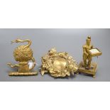 An ormolu figural stand and two decorative gilt metal furniture mounts