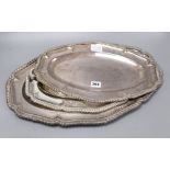 Three plated serving dishes, shaped and gadroon-bordered, widest 51cm
