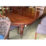 A Victorian mahogany extending dining table by Edwards and Roberts, together with an oak table