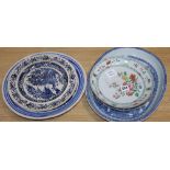 An early 19th century Chinese floral plate, a Chinese blue and white plate and meat platter,