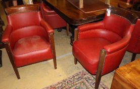 A set of six mahogany framed tub shaped theatre viewing armchairs, with red leather upholstery (by