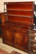 A late regency chiffonier sideboard with open rack over