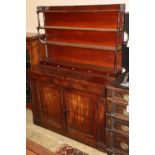 A late regency chiffonier sideboard with open rack over