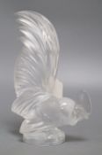 A Lalique glass 'cockerel' car mascot, height 21cmCONDITION: It has a large chip to the tip of its