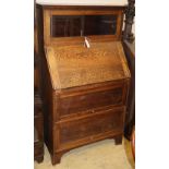 A Globe Wernicke style oak bureau bookcase, W.79cm, D.42cm, H.138cm