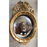 A Regency giltwood and gesso convex wall mirror, 63cm diameter, H.87cm