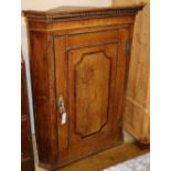 A George III inlaid oak hanging corner cupboard, W.73cm, D.45cm, H.100cm