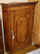 A George III inlaid oak hanging corner cupboard, W.73cm, D.45cm, H.100cm