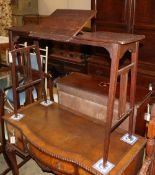 An Edwardian oak adjustable reading table, W.94cm, D.34cm, H.70cm