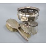 A small silver rose bowl, two brushes and a jar, 648 grams gross