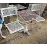 A cast iron garden table with marble top, W.53cm, H.70cm and two metal folding chairs