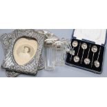 Two early 20th century silver photo frames, a cased set of 6 silver coffee spoons, a silver