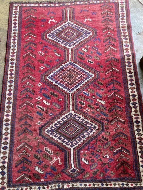 A Qashqai red ground rug, 226 x 160cm