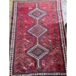 A Qashqai red ground rug, 226 x 160cm