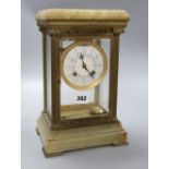 A four glass onyx and brass clock, height 31cm