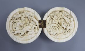 A 19th century Dieppe ivory noix ball diptych, the interior carved with hunting scenes, 5.5