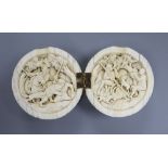 A 19th century Dieppe ivory noix ball diptych, the interior carved with hunting scenes, 5.5