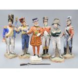 Five Naples porcelain soldiers and a Dresden beefeater, tallest 18cm