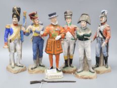 Five Naples porcelain soldiers and a Dresden beefeater, tallest 18cm