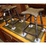 A pair of late Victorian carved oak stools, W.29cm, H.49cm