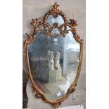 A reproduction gilt framed shield shaped wall mirror, W.62cm, H.106cm