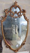 A reproduction gilt framed shield shaped wall mirror, W.62cm, H.106cm