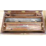 A 19th century mahogany artist's paint box including brushes