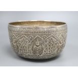 A Burmese silver bowl, c.1900, with repousse Buddha panels, 14.3oz., diameter 21cm