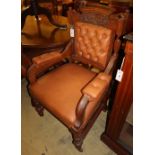 A set of eight Edwardian carved oak and tan leather upholstered dining chairs (two with arms)